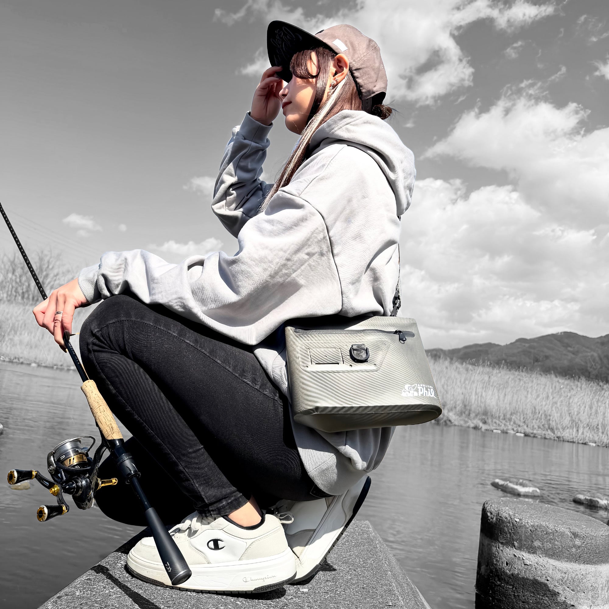 Wading Dry Pouch used as a shoulder bag while fishing in the river