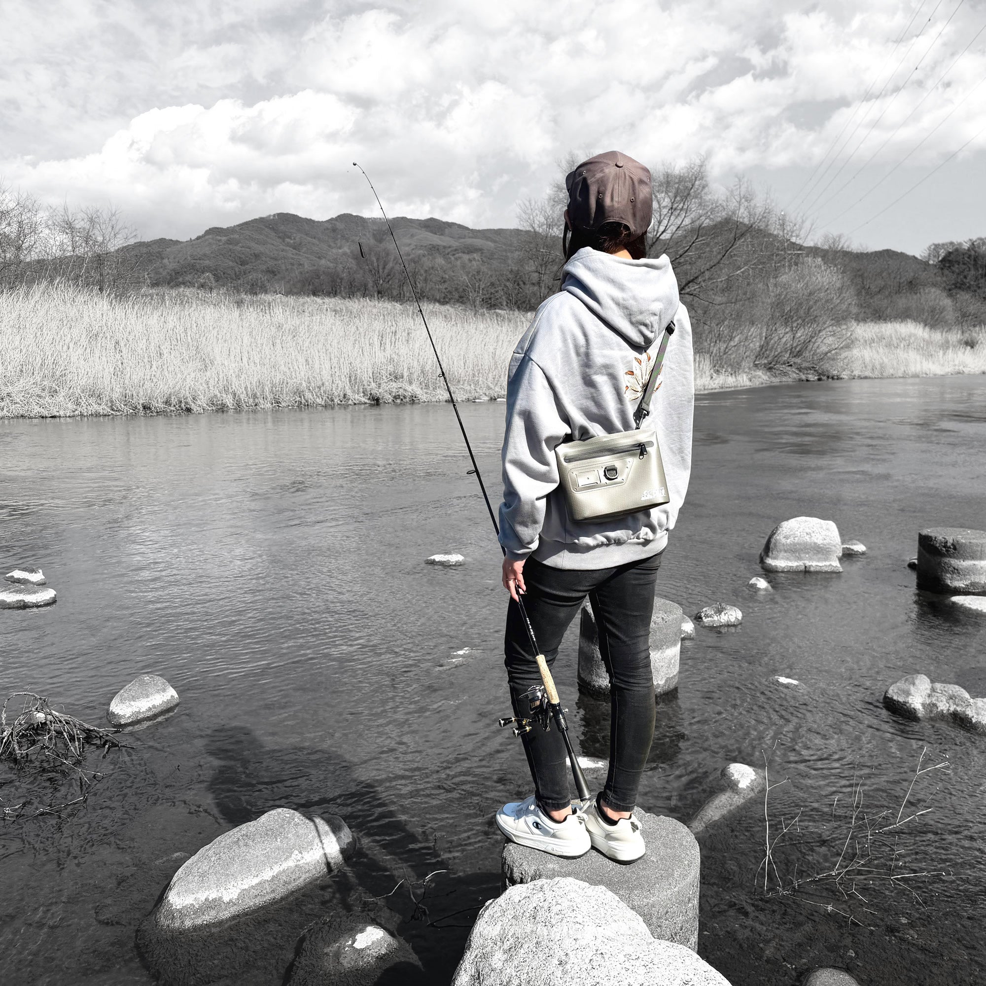 Waterproof fishing pouch attached directly to a wader belt